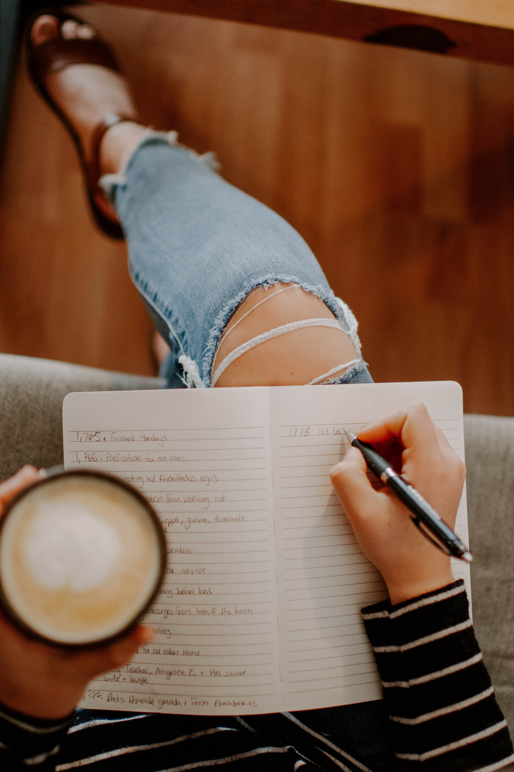 Person Writing on a Journal