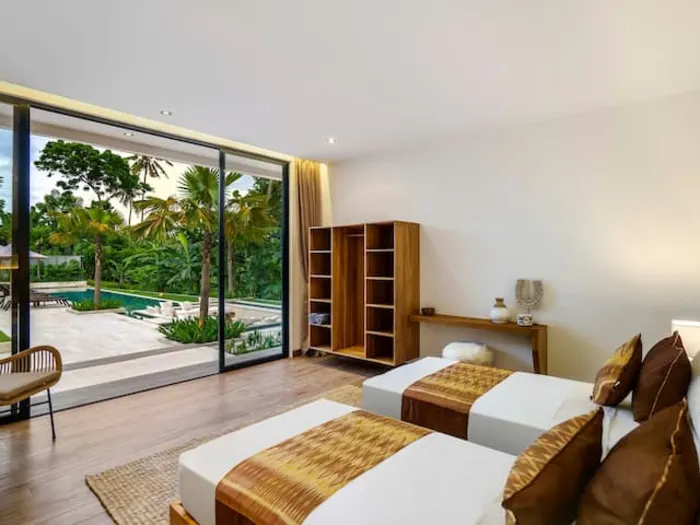 A twin room with two single beds at the villa