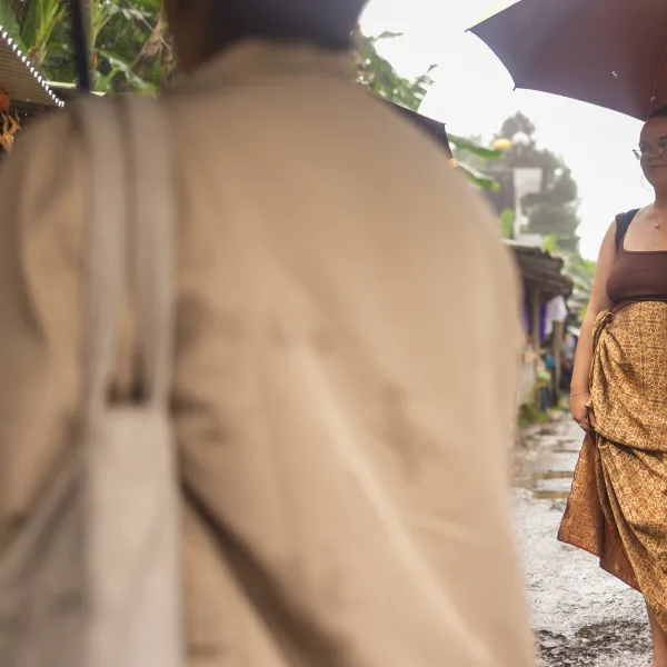 Guests walking through Ubud in the rain
