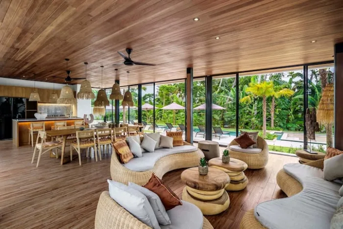 The living and dining pavilion opening onto the garden and pool