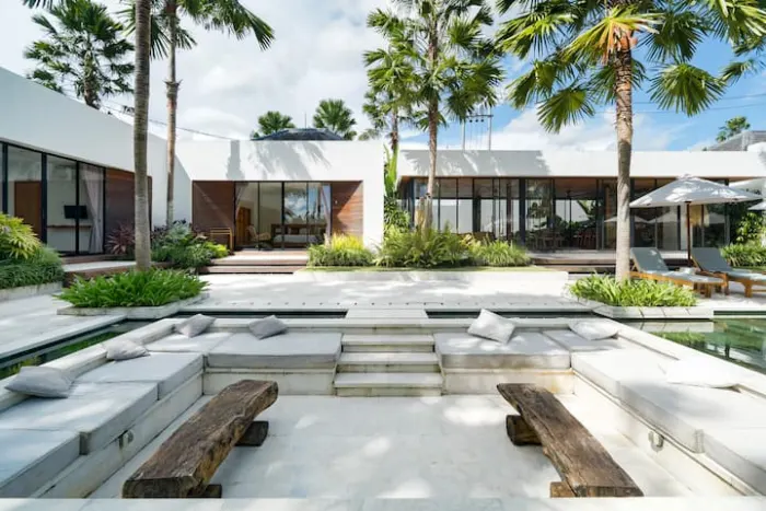 A sunken lounge beside the water in the villa courtyard